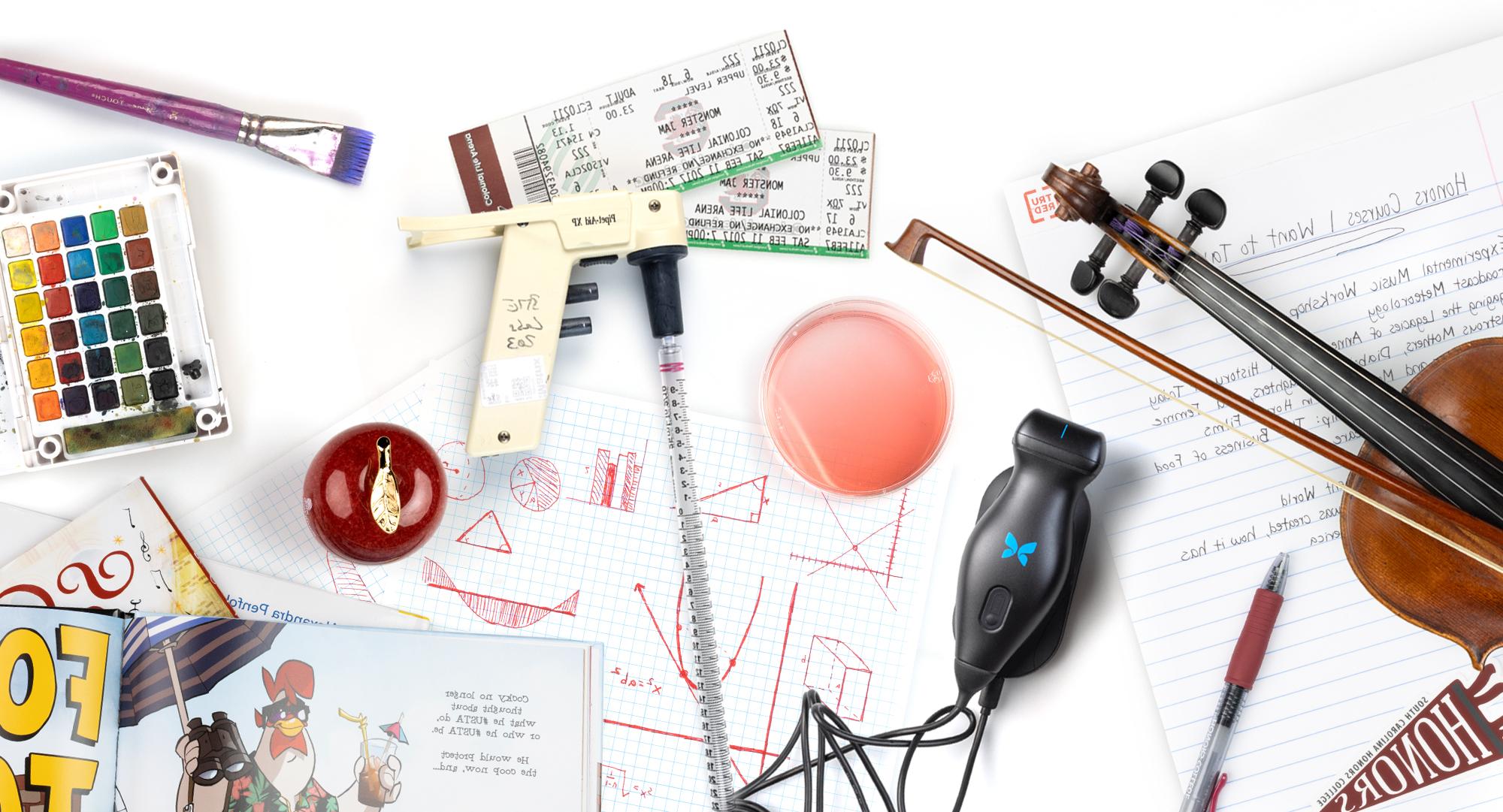 A collection of items, including a violin, 电影票, writing utensils, and drawings on graph paper, that represent the colleges at the university.